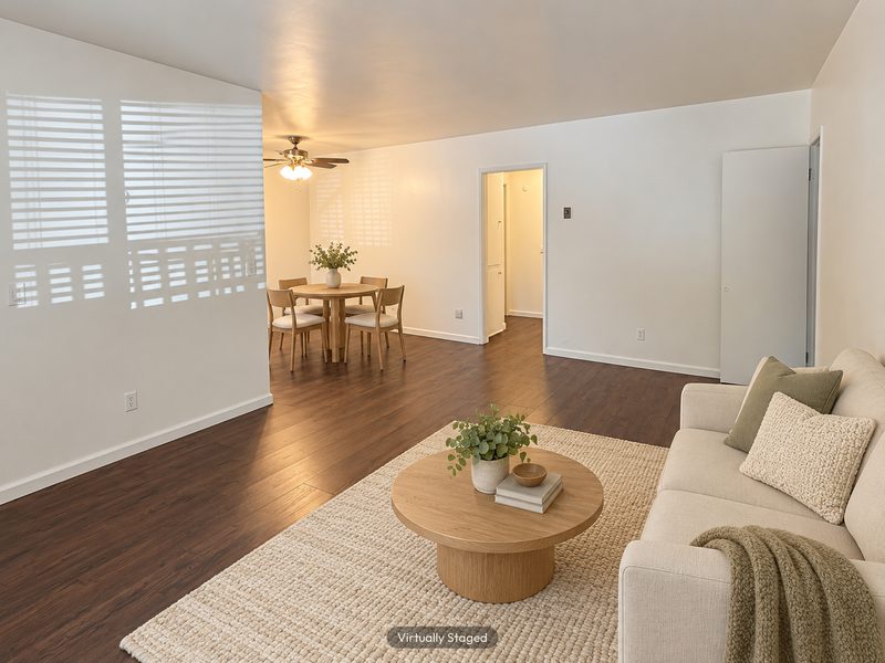 Unit C living room toward the dining area, virtually staged