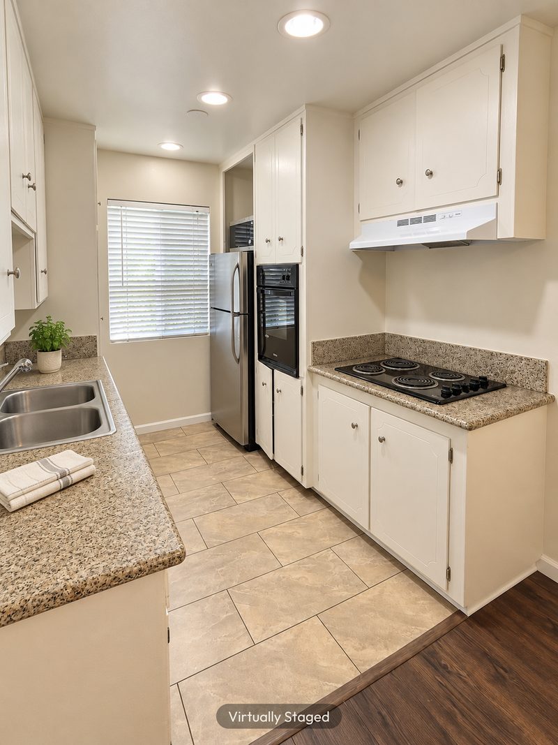 Unit C kitchen, range and oven, virtually staged