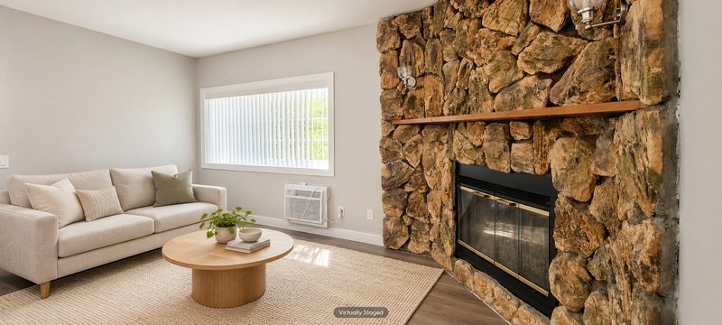 Unit D living room, fireplace wall, virtually staged