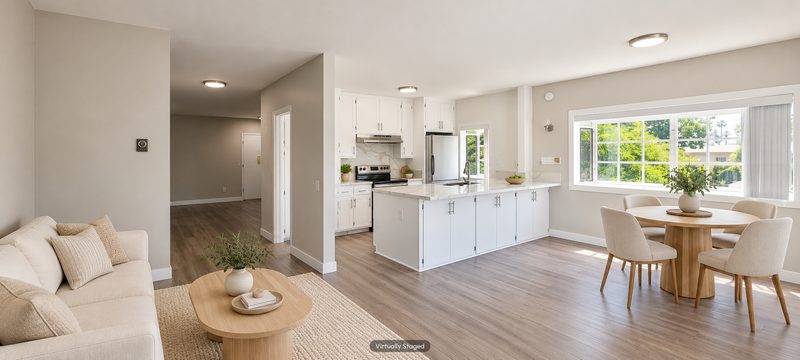 Unit D living area and kitchen, virtually staged