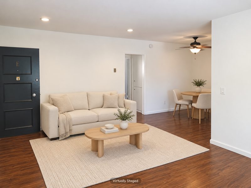 Unit E living and dining area, virtually staged