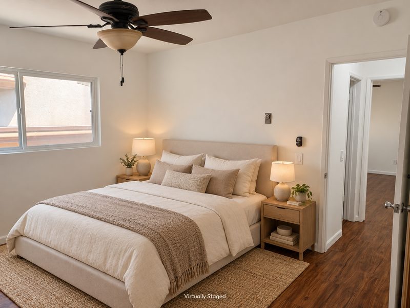 Unit E bedroom toward the hall, virtually staged