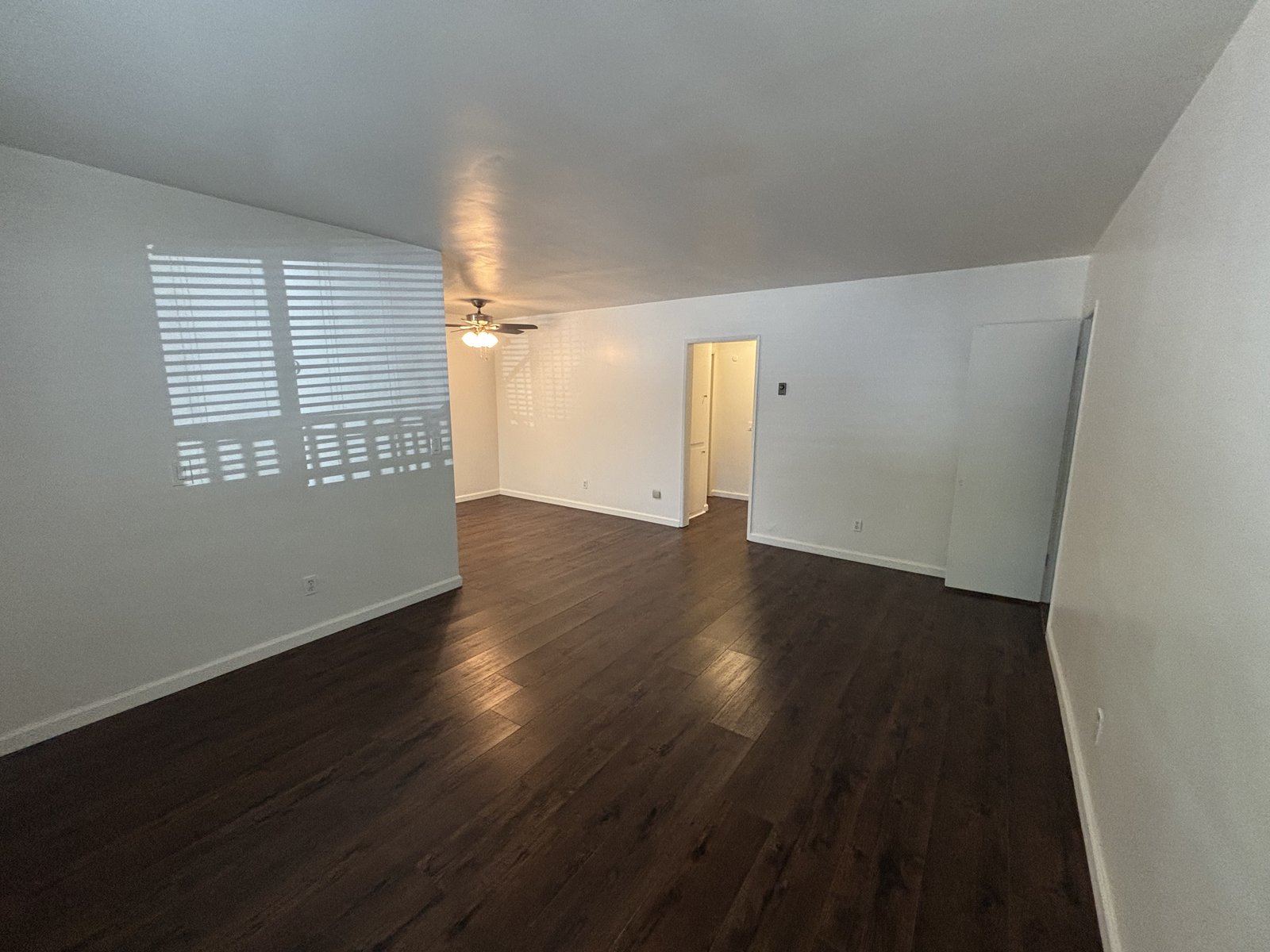 Unit C living room toward the dining area, original unaltered photo