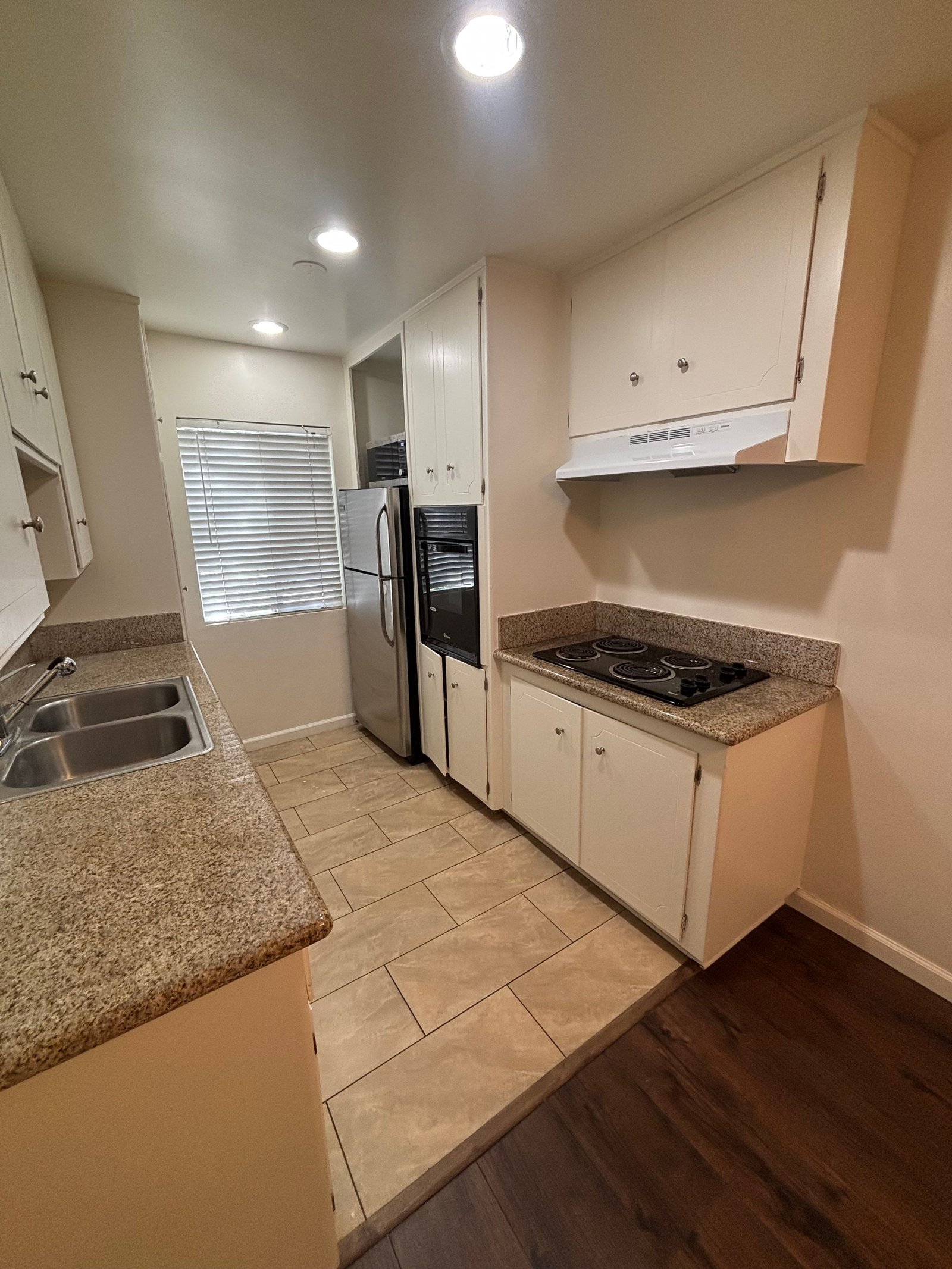 Unit C kitchen, range and oven, original unaltered photo