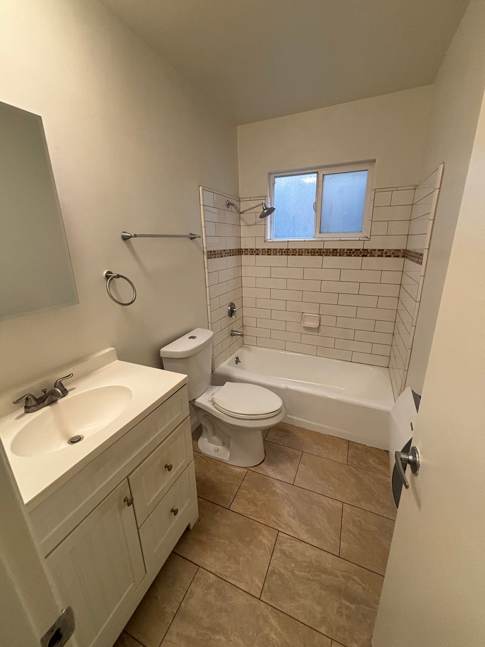Unit C bathroom with tub, original unaltered photo
