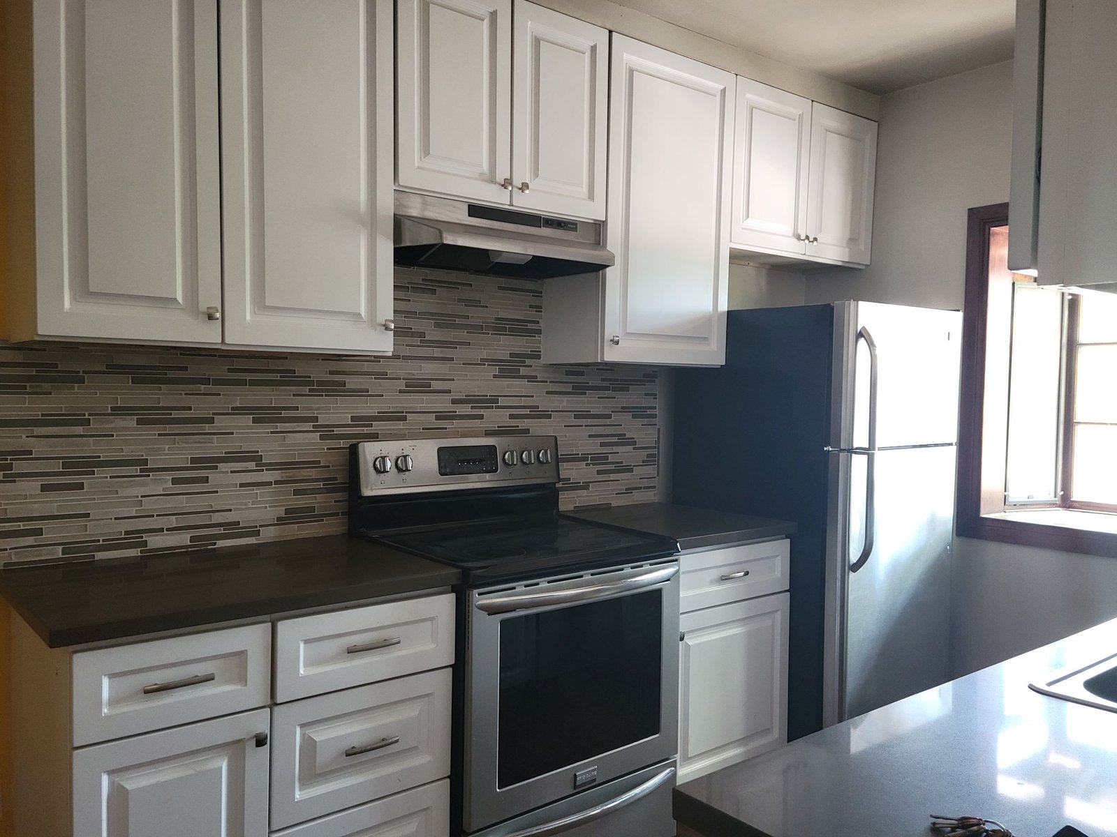Unit E kitchen, original unaltered photo
